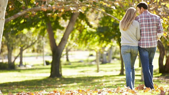 Couple Walking In Autumn
